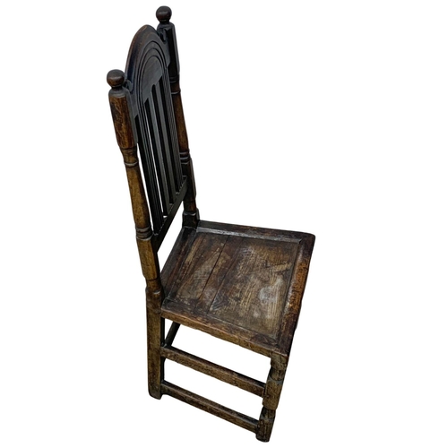 1084 - A 17th century oak hall chair. Made in the Carolean period. Circa 1660-1680.