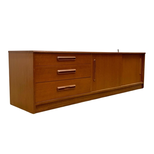 1088 - A teak Mid Century low-board. 183 x 44 x 51.5cm