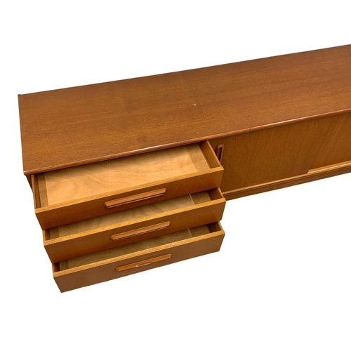 1088 - A teak Mid Century low-board. 183 x 44 x 51.5cm