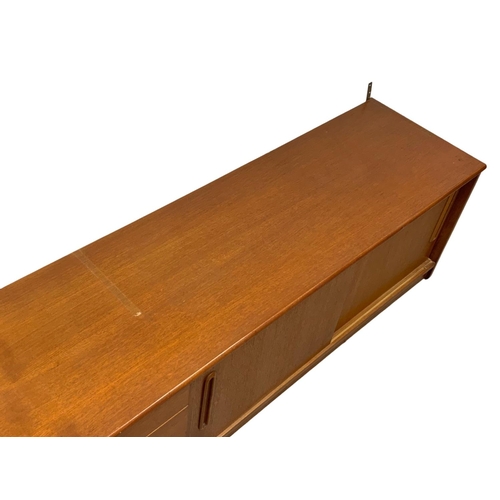 1088 - A teak Mid Century low-board. 183 x 44 x 51.5cm