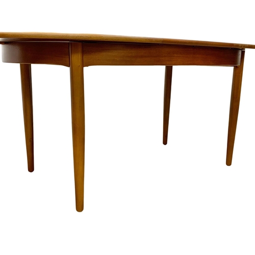 1089 - A teak Mid Century extending dining table and 6 chairs. Open 199 x 91 x 74.5cm. Closed 152.5cm.