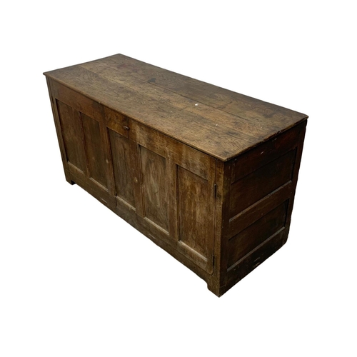 1091 - An 18th century oak meal bin converted to cupboard. 157 x 61 x 83cm.