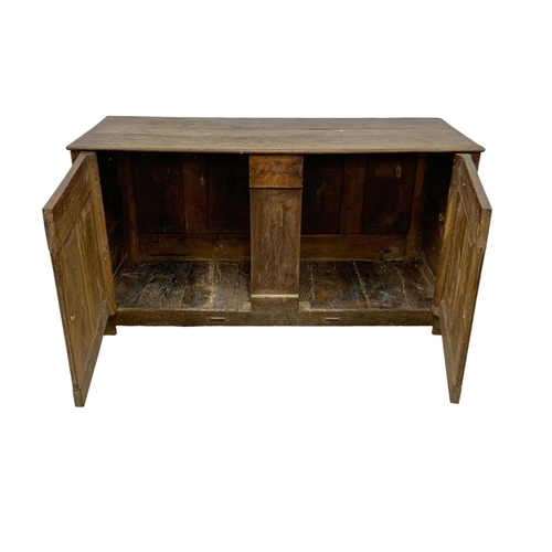 1091 - An 18th century oak meal bin converted to cupboard. 157 x 61 x 83cm.