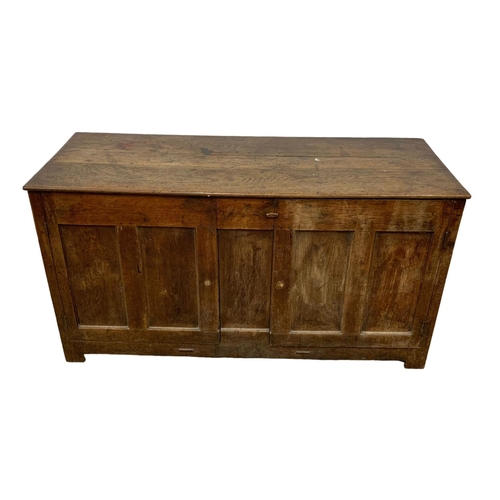 1091 - An 18th century oak meal bin converted to cupboard. 157 x 61 x 83cm.