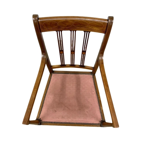 1093 - An Edwardian inlaid mahogany hall chair.