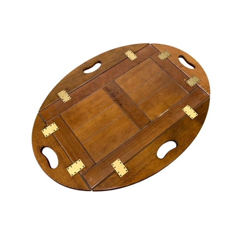 1097 - A mahogany butlers tray on stand. 70 x 45 x 57cm