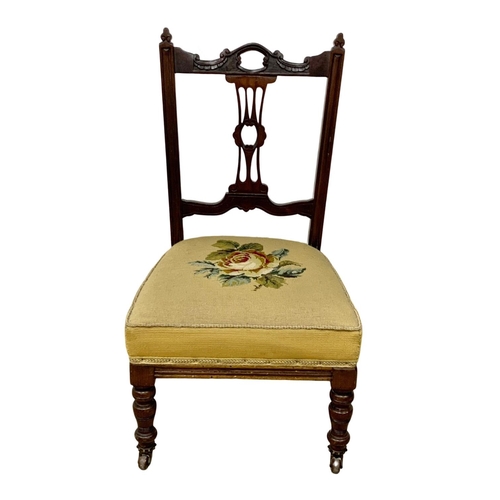 1098 - A late Victorian mahogany nursing chair. Circa 1890.