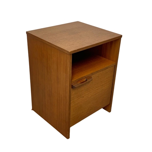 1101 - An Austinsuite teak bedside and a teak framed mirror. 33 x 125.5cm.