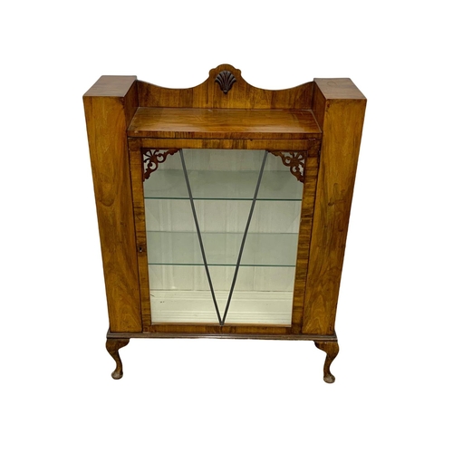 1109 - An Art Deco walnut china cabinet. Circa 1930-1940. 86 x 28 x 114cm.