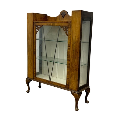 1109 - An Art Deco walnut china cabinet. Circa 1930-1940. 86 x 28 x 114cm.