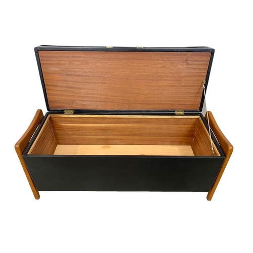 1155 - A Mid Century storage ottoman box in black vinyl. 1960's-1970's 98 x 36 x 42.5cm.