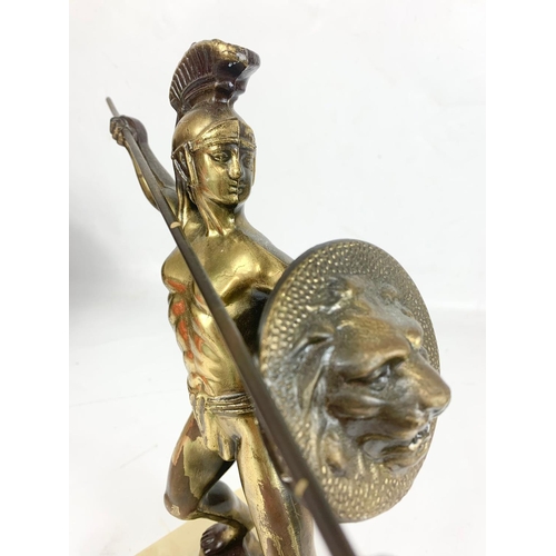 384 - A vintage brass figure on a marble base. 32cm.