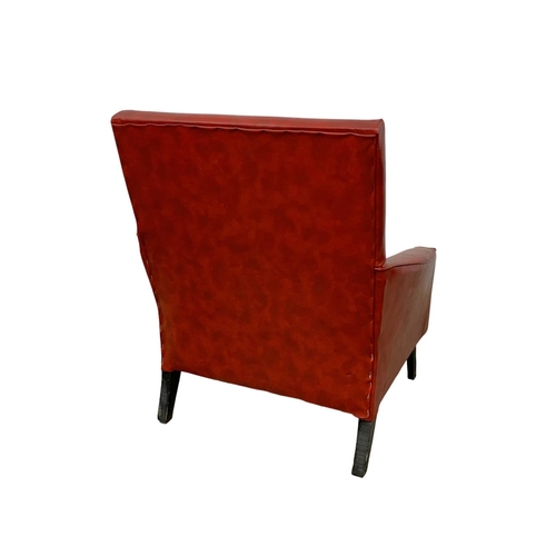 1117 - A 1960’s Mid Century red vinyl armchair