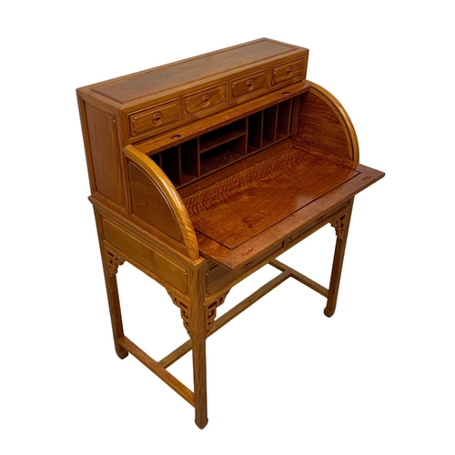 1133 - A Chinese teak role top cylinder desk and matching chair. 88.5 x 54.5 x 117cm.