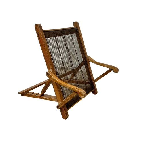 1140 - A 1930’s pitch pine sun lounger.