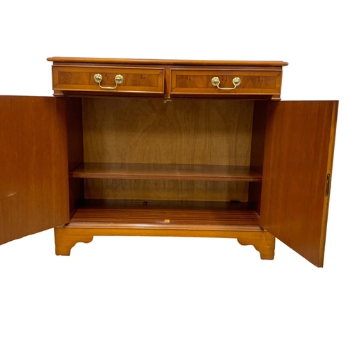 1142 - A small Yew wood 2 drawer sideboard. 91 x 42 x 84cm