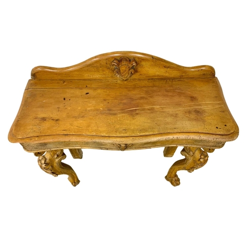 1148 - A Victorian pine console table on cabriole legs. Circa 1870. 96 x 38 x 99cm.