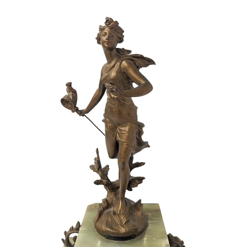 324 - A 19th century French ornate onyx clock with spelter figure, circa 1870s. With key and pendulum. 28 ... 