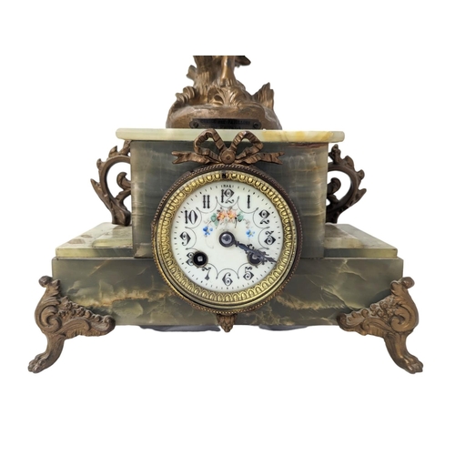 324 - A 19th century French ornate onyx clock with spelter figure, circa 1870s. With key and pendulum. 28 ... 