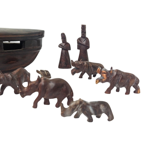 331 - A wooden model of Noah's Arc with animals, made of Padauk wood. Length of arc is 30cm