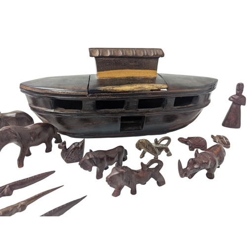 331 - A wooden model of Noah's Arc with animals, made of Padauk wood. Length of arc is 30cm