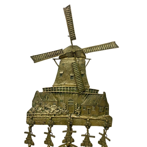 343 - A tall late 19th century brass windmill fire tool stand. 138cm