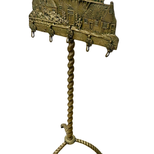 343 - A tall late 19th century brass windmill fire tool stand. 138cm