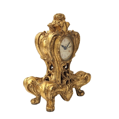 348 - An ornate girl mantle clock. 17.5x23.5cm