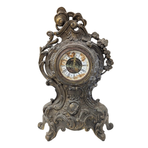 349 - A brass lamp with an ornate mantle clock.