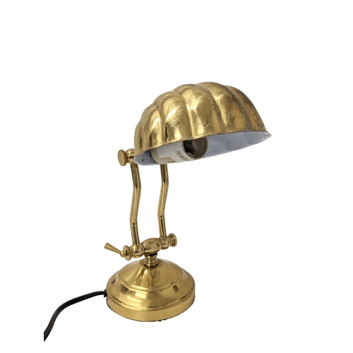 349 - A brass lamp with an ornate mantle clock.