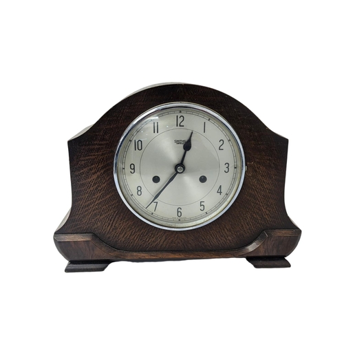 357 - An early 20th century oak cased mantle clock. 31x12x23cm