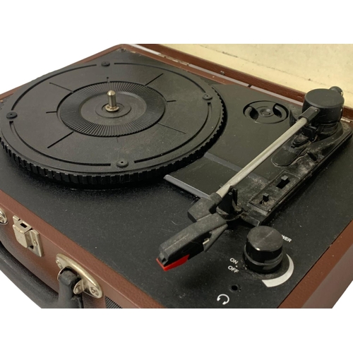 366 - A Bush portable turntable. 35.5 x 26.5cm.