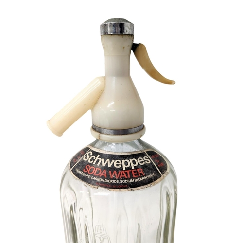 369 - A vintage Schweppes soda bottle. 29cm