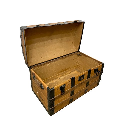 281 - An early 20th century dome top trunk. 86 x 45 x 52cm.