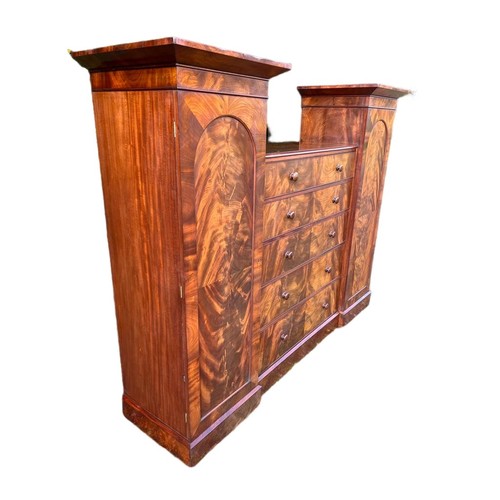 791 - A large Victorian mahogany wardrobe with exterior drawers