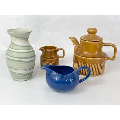 540A - A Carrig Irish glazed pottery tea pot and milk jug, with a Poole Pottery jug and another vase.