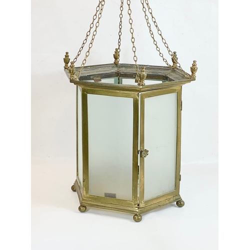 11 - A large Edwardian brass lantern with glass panels and stained glass panel base. 45 x 47cm