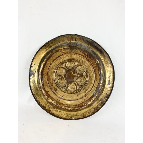 21 - A late 19th century brass wall plaque. 45.5cm