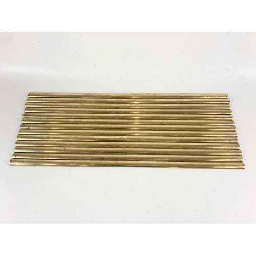 23 - A quantity of vintage brass stair rods 68.5cm.