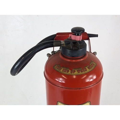 31 - A vintage Fire Extinguisher. 65cm