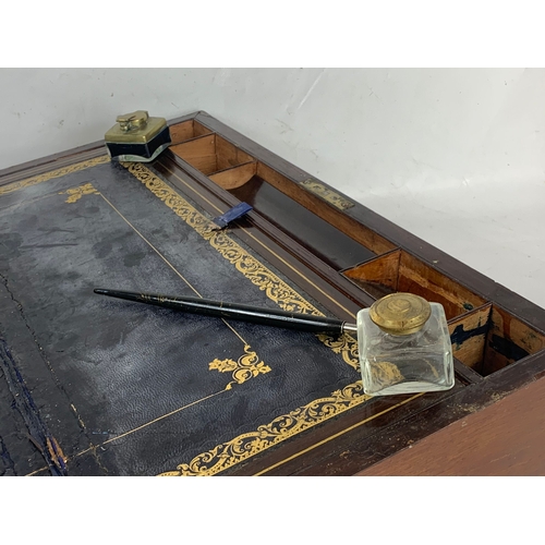 62 - A Victorian brass inlaid mahogany writing slope, with ink wells. 50 x 26 x 17cm closed.