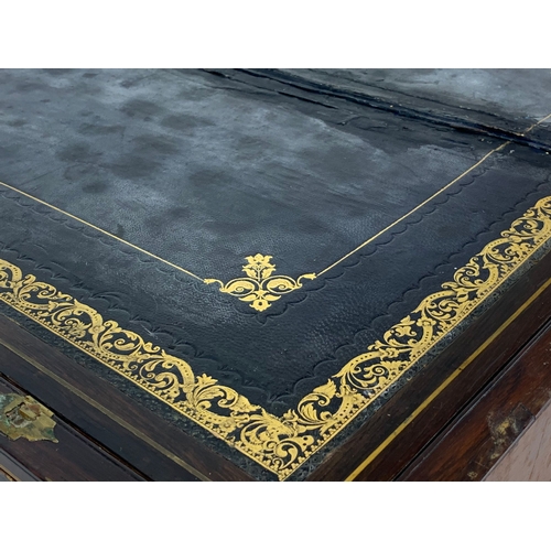 62 - A Victorian brass inlaid mahogany writing slope, with ink wells. 50 x 26 x 17cm closed.