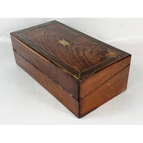 62 - A Victorian brass inlaid mahogany writing slope, with ink wells. 50 x 26 x 17cm closed.