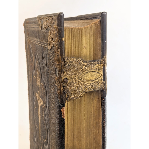 76 - A late 19th century leather and brass Bible.