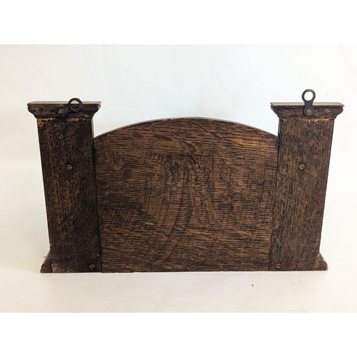 79 - An Edwardian oak smoker's pipe stand. 30x7x19.5cm