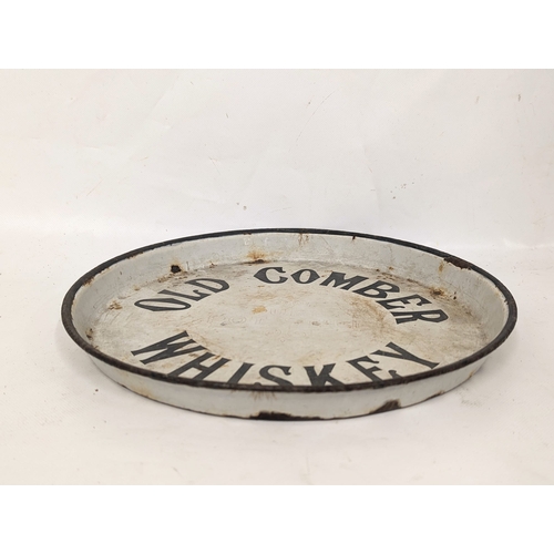 84 - A vintage Old Comber Whiskey enamel pub tray. 30.5x3cm