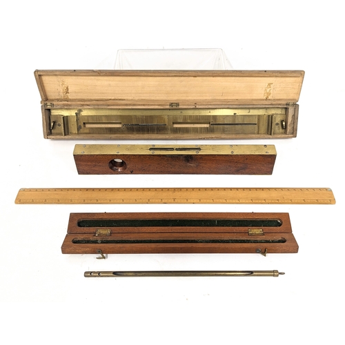 86 - A collection of early 20th century precision tools, including a brass Alidade, spirit level,  a medi... 