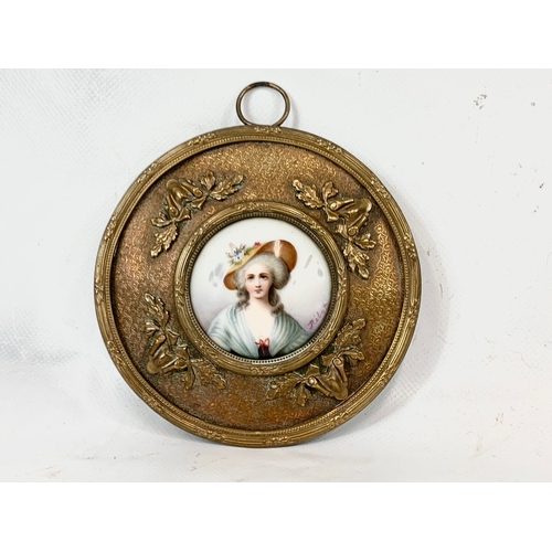 93 - A 19th century French hand painted signed miniature, in brass frame. Ribot. 10.5cm