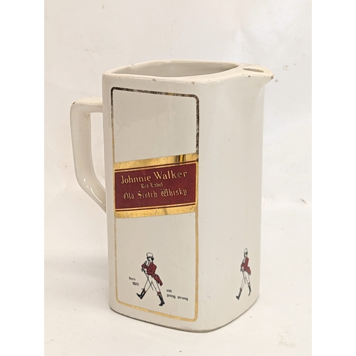 409 - A vintage Johnnie Walker Red Label Scotch Whisky water jug. 15x16.5cm