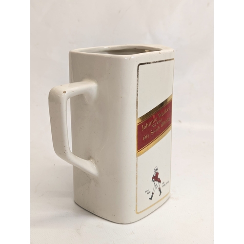 409 - A vintage Johnnie Walker Red Label Scotch Whisky water jug. 15x16.5cm